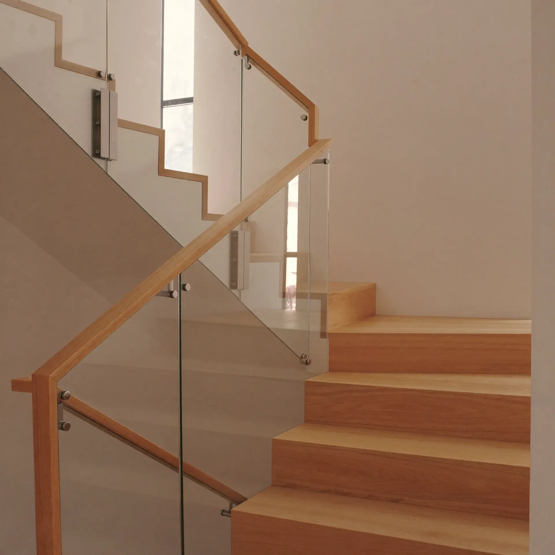 Frameless glass railing on a modern staircase